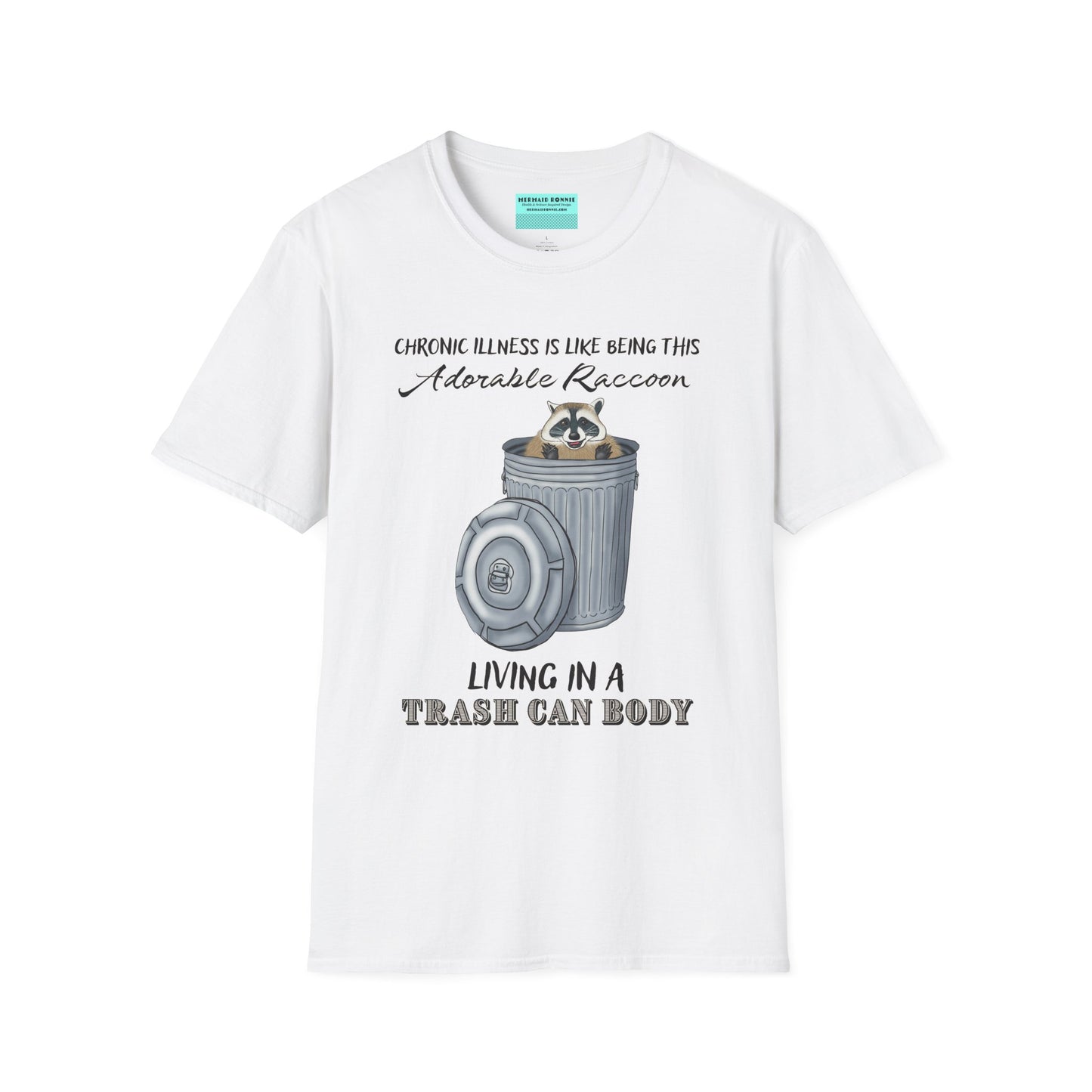 White t-shirt featuring an illustration of a raccoon in a metal trash can, with the phrase 'Chronic illness is like being this adorable raccoon living in a trash can body' printed on it.