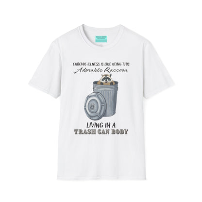 White t-shirt featuring an illustration of a raccoon in a metal trash can, with the phrase 'Chronic illness is like being this adorable raccoon living in a trash can body' printed on it.