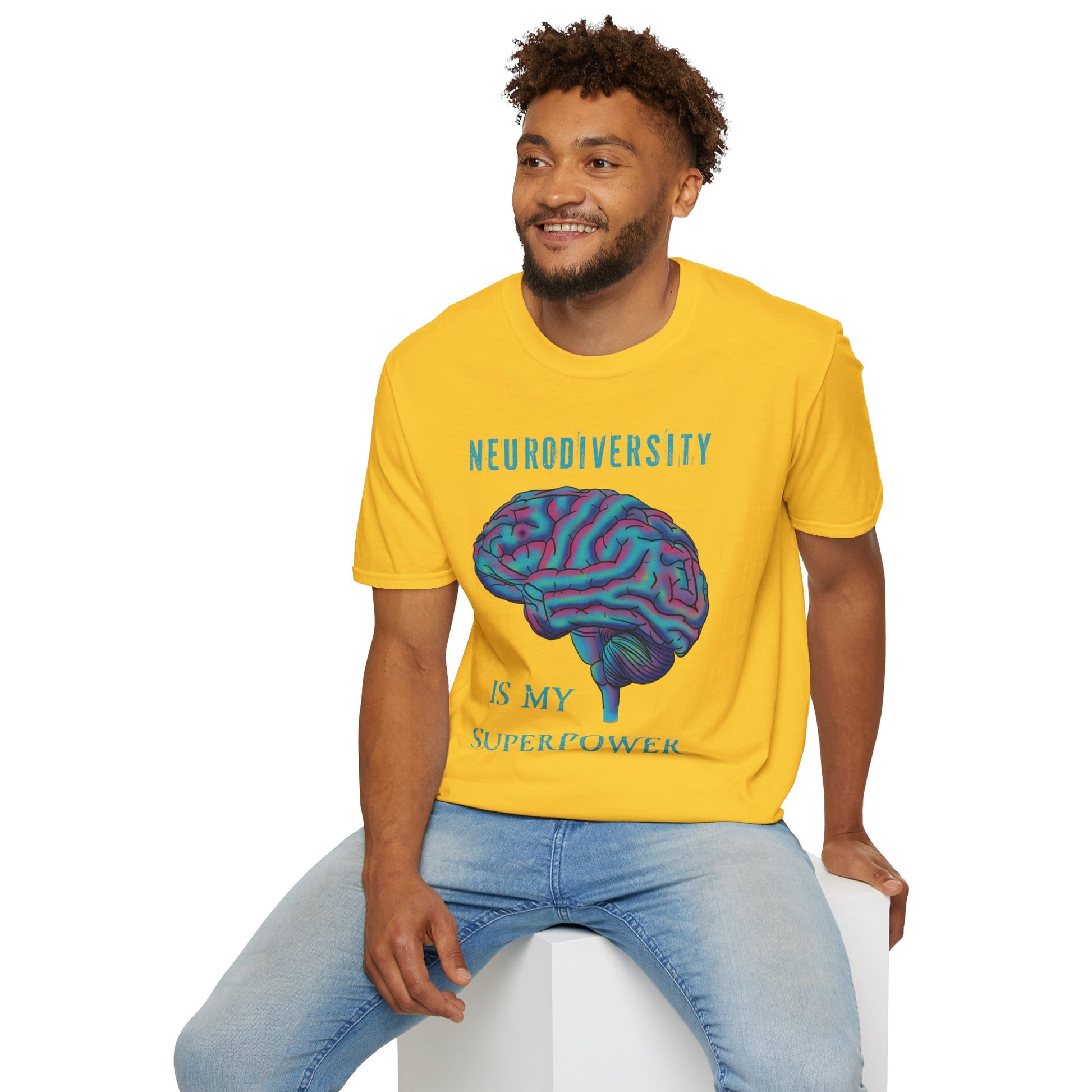 Man wearing a yellow t-shirt featuring an anatomical drawing of a brain, with the phrase 'Neurodiversity is my superpower' printed on it.