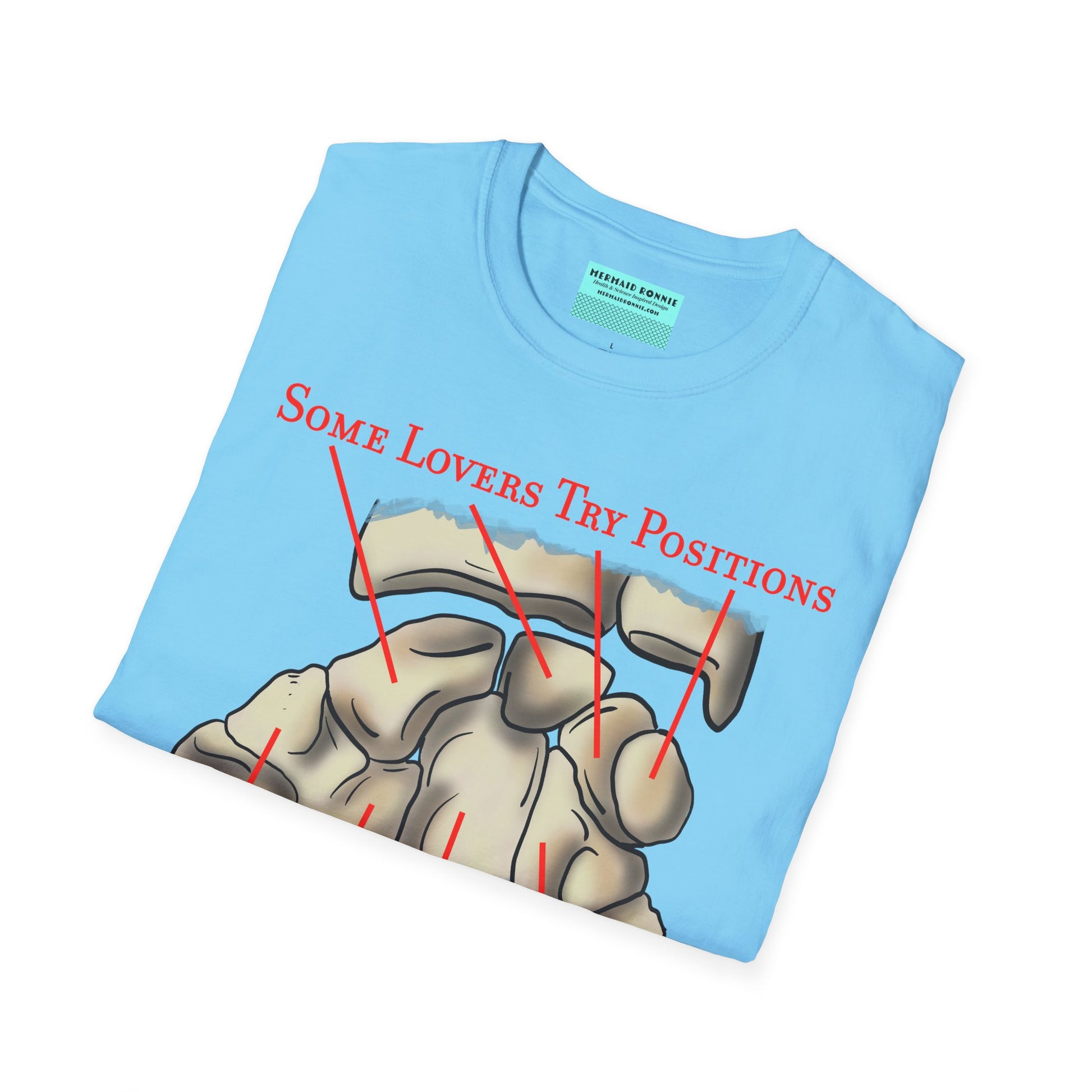Folded blue t-shirt featuring an anatomical drawing of the carpal bones, with the mnemonic 'Some lovers try positions that they can't handle' displayed.
