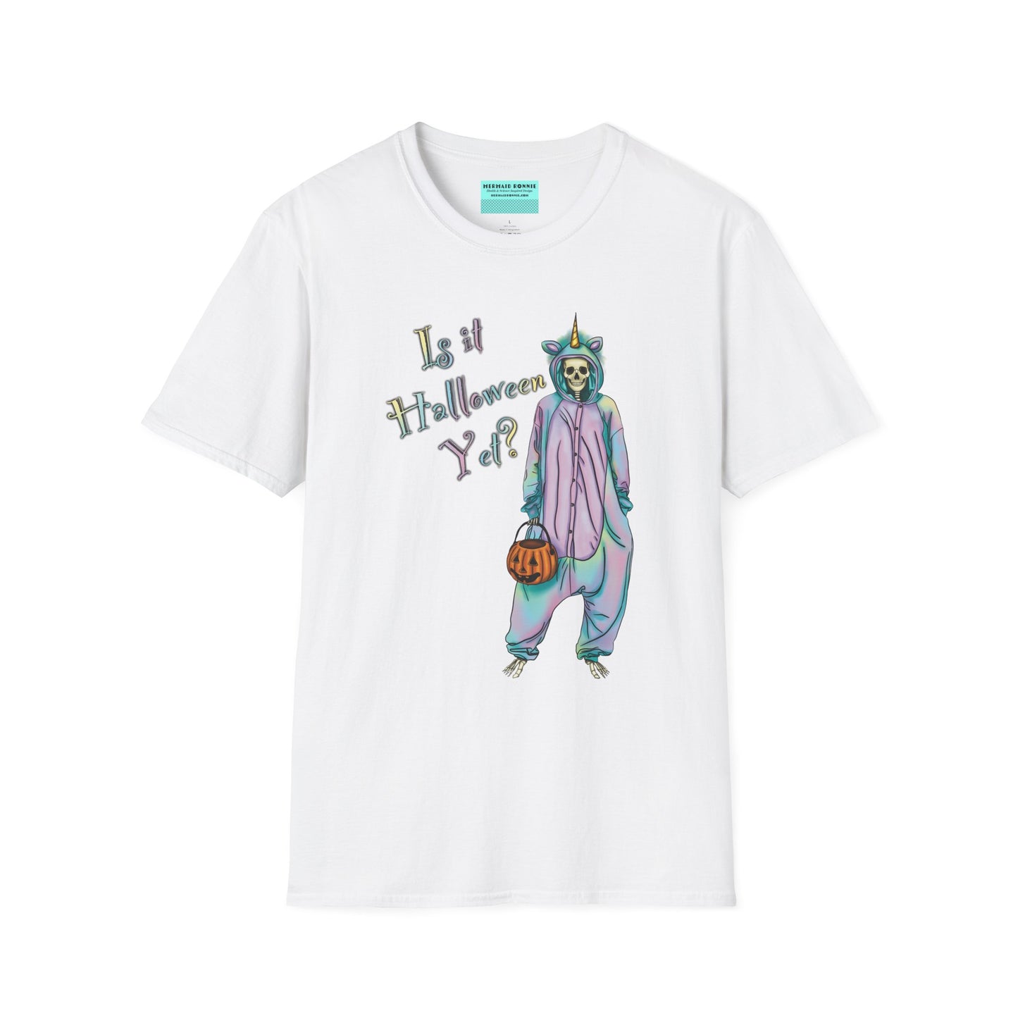 White t-shirt featuring a drawing of a skeleton in a unicorn costume onesie, with the phrase 'Is it Halloween yet?' printed on it.