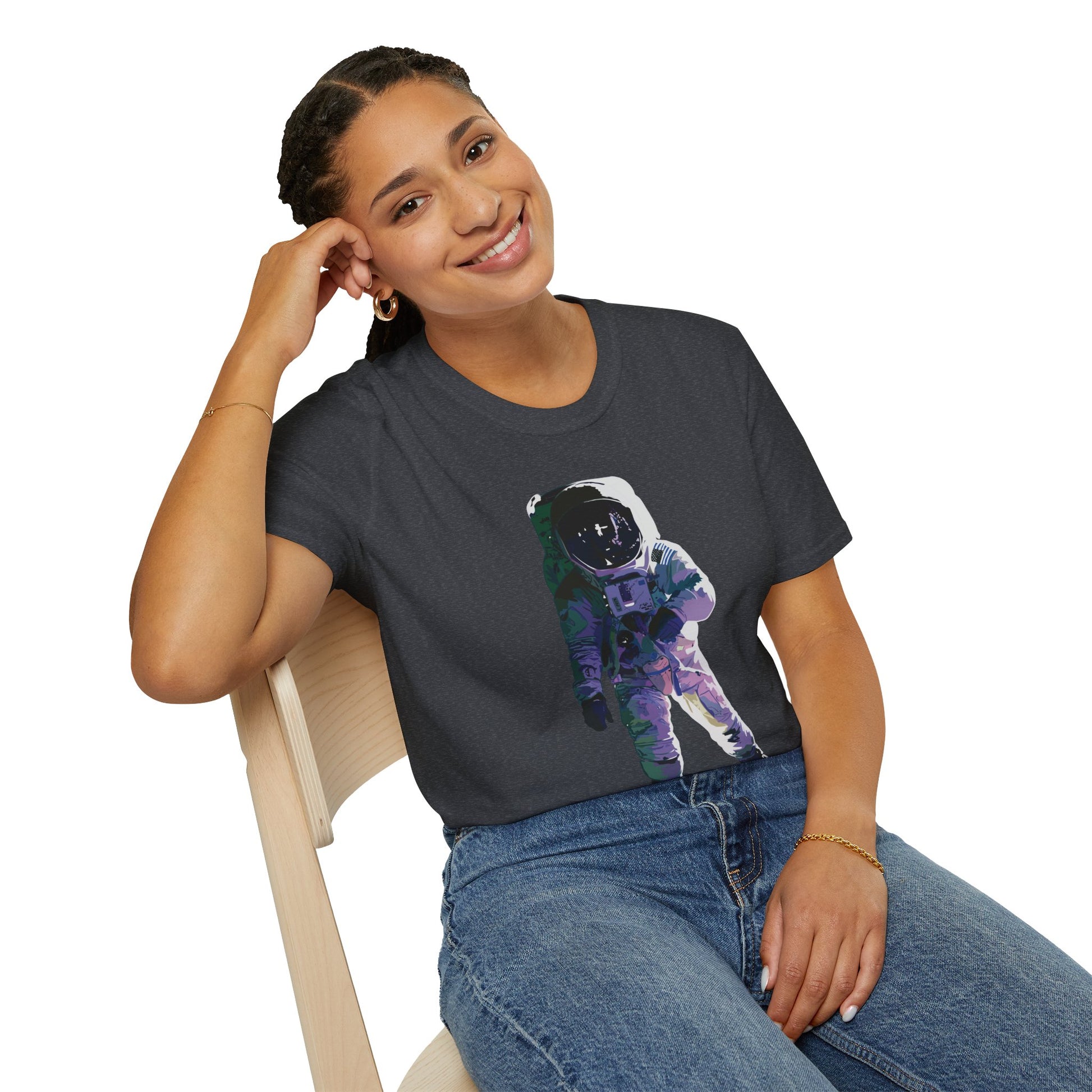 Woman wearing a dark grey t-shirt featuring a drawing of an astronaut in a space suit.