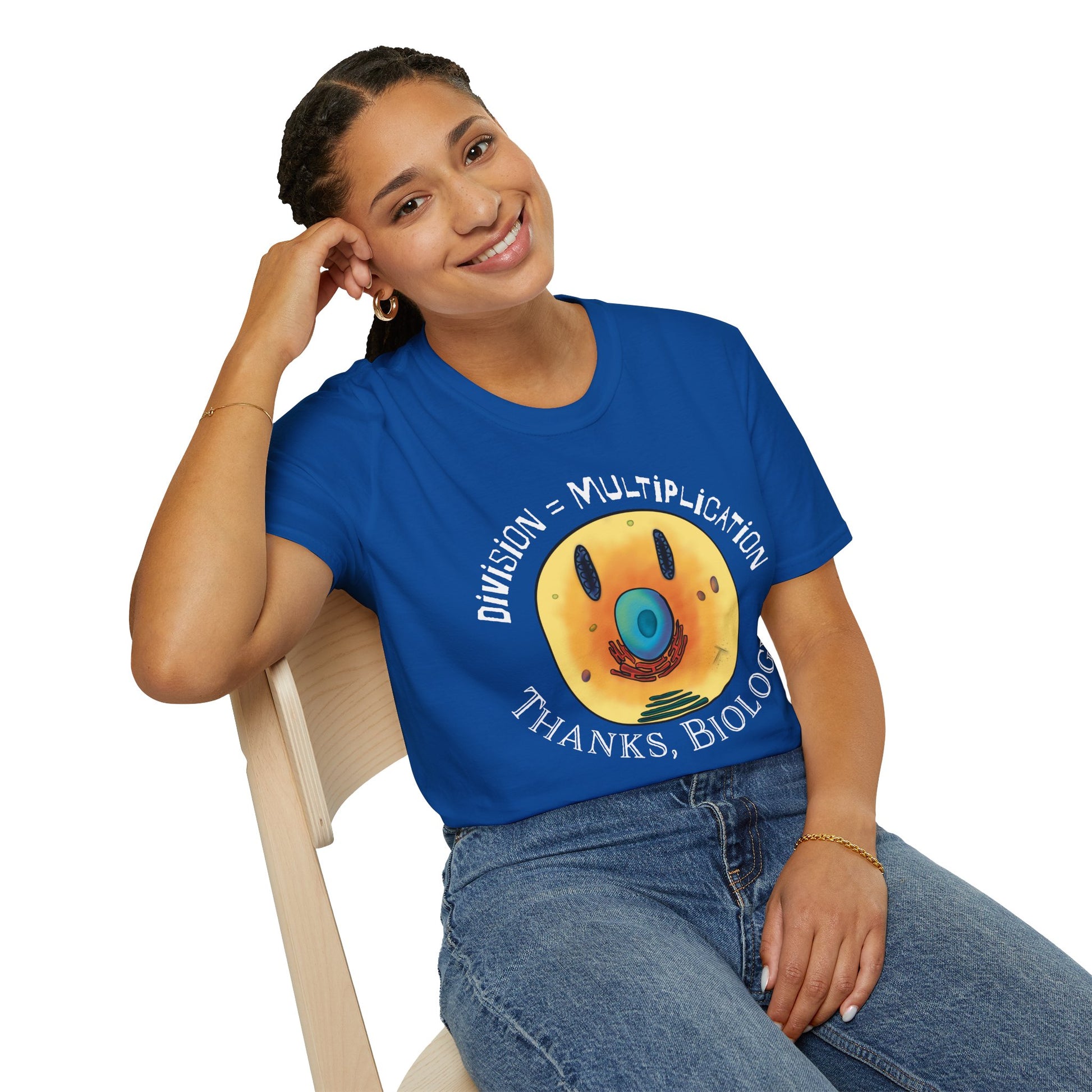 Woman wearing a royal blue t-shirt featuring an illustration of a cell, with cellular organelles arranged to create a smiley face. The text 'Division = Multiplication. Thanks, Biology' is displayed surrounding the image.