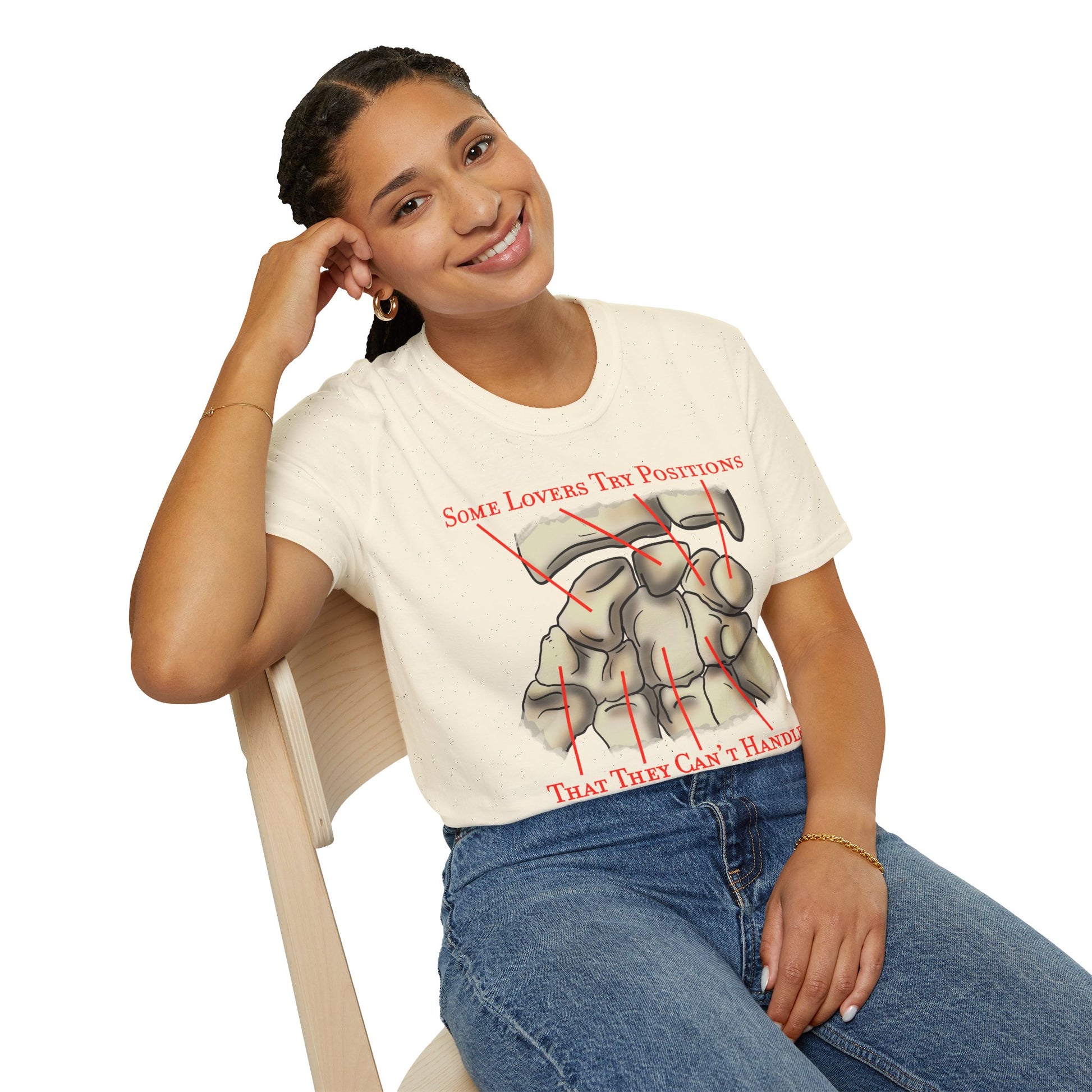 Woman wearing a beige t-shirt featuring an anatomical drawing of the carpal bones, with the mnemonic 'Some lovers try positions that they can't handle' displayed.