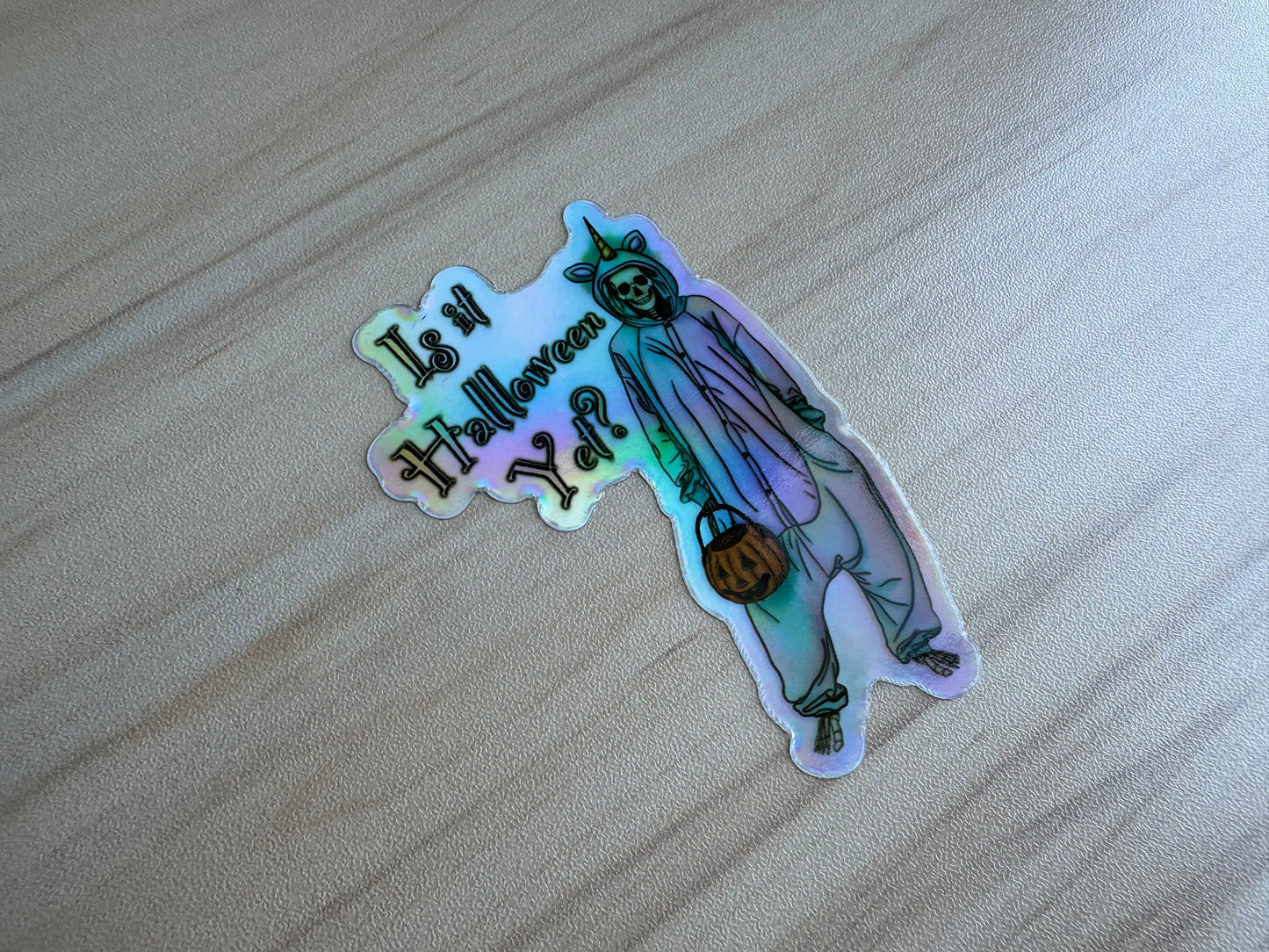 Holographic Halloween Skeleton Sticker, Skeleton in a Unicorn Costume, ‘Is it Halloween yet’ Vinyl Decal