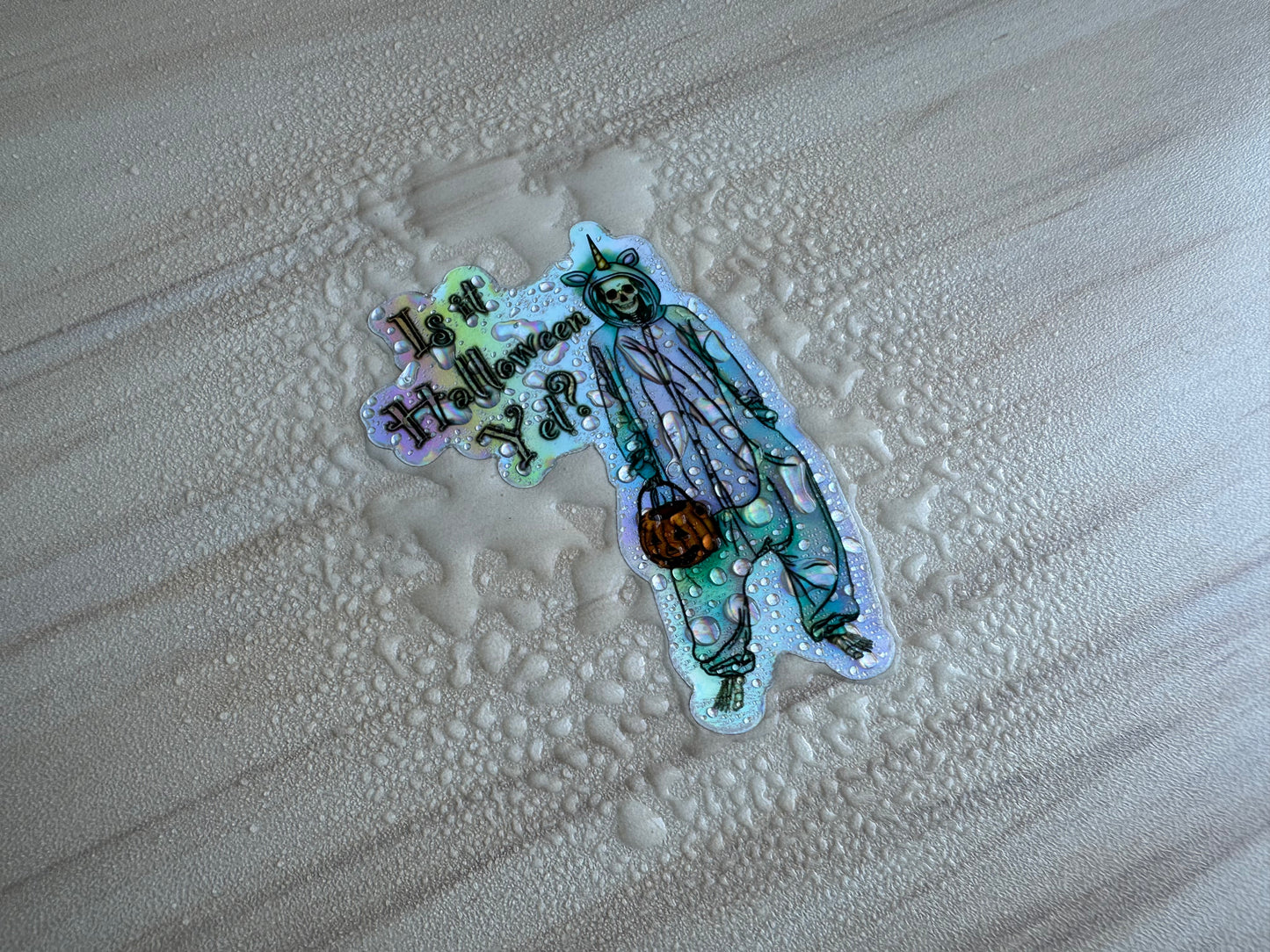 Holographic Halloween Skeleton Sticker, Skeleton in a Unicorn Costume, ‘Is it Halloween yet’ Vinyl Decal